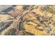 This aerial shot showcases the area's diverse landscape, with open fields, clustered trees, and established power lines at 7270 Long Island Rd, Catawba, NC 28609