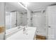 Well-lit bathroom featuring a white sink vanity, large mirror, walk-in shower with glass door and tile flooring at 7270 Long Island Rd, Catawba, NC 28609
