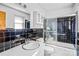 Well-lit bathroom featuring a swan-themed shower door and classic black tile at 7270 Long Island Rd, Catawba, NC 28609