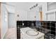 Bathroom featuring black tile and a white vanity, offering a clean and classic look at 7270 Long Island Rd, Catawba, NC 28609