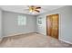 Cozy bedroom featuring a wooden closet door and windows for natural light at 7270 Long Island Rd, Catawba, NC 28609