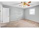 Spacious bedroom featuring neutral carpet, a ceiling fan, and ample natural light at 7270 Long Island Rd, Catawba, NC 28609