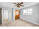 Bright bedroom featuring a wooden closet door and large windows at 7270 Long Island Rd, Catawba, NC 28609