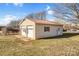 A two-car garage has neutral siding and is situated on a grassy lot under a bright sky at 7270 Long Island Rd, Catawba, NC 28609