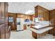 Traditional style kitchen with breakfast bar, white appliances, and wood cabinetry at 7270 Long Island Rd, Catawba, NC 28609