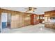 Spacious living room featuring paneled walls, ceiling fan, and neutral flooring at 7270 Long Island Rd, Catawba, NC 28609