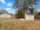 Spacious backyard featuring a storage shed, offering practical outdoor storage solutions and room to roam at 7926 Sir Barton Ct, Charlotte, NC 28215