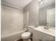 Well-maintained bathroom features a combined tub and shower, a toilet, and a vanity sink with a mirrored cabinet at 7926 Sir Barton Ct, Charlotte, NC 28215