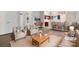 Sun-filled living room with neutral tones and a view of the open-concept kitchen featuring a bar-style countertop at 7926 Sir Barton Ct, Charlotte, NC 28215