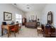 Bedroom featuring neutral walls, carpet, a writing desk, large window and a full size bed at 8568 Windsor Ridge Dr, Charlotte, NC 28277
