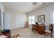 Carpeted bedroom with neutral walls featuring a window, closet, and classic decor at 8568 Windsor Ridge Dr, Charlotte, NC 28277