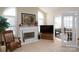 Inviting living room with a fireplace, flooded with natural light, connecting to a bright sunroom at 8568 Windsor Ridge Dr, Charlotte, NC 28277