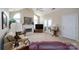 Spacious living room featuring a fireplace, plush carpet, and ample natural light from large windows at 8568 Windsor Ridge Dr, Charlotte, NC 28277