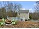 Backyard features in-ground pool with large surrounding deck and fire pit at 946 Laurelwood Dr, Clover, SC 29710