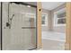 Spacious bathroom with glass shower and soaking tub by windows at 946 Laurelwood Dr, Clover, SC 29710