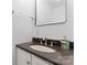 Modern bathroom vanity with a dark countertop, sink, and stylish soap dispenser at 946 Laurelwood Dr, Clover, SC 29710