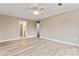 Spacious bedroom with wood flooring, ceiling fan, and attached bathroom at 946 Laurelwood Dr, Clover, SC 29710
