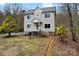 Charming two-story home with gray roof and a landscaped yard, and a cozy front porch at 946 Laurelwood Dr, Clover, SC 29710