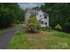 Inviting two-story home featuring a front yard, cozy porch, and natural surrounding at 946 Laurelwood Dr, Clover, SC 29710