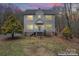 Two-story home with inviting porch and large windows, set against a twilight sky at 946 Laurelwood Dr, Clover, SC 29710