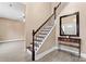 Foyer with staircase, stylish table, a mirror, and light wood-look flooring at 946 Laurelwood Dr, Clover, SC 29710