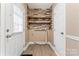 The mud room is complete with a storage shelf and access to the outside at 946 Laurelwood Dr, Clover, SC 29710