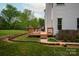 Wooden deck in backyard featuring a view of the expansive yard, and mature trees at 1006 Baldwin Ln, Waxhaw, NC 28173