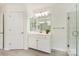 Bright bathroom featuring a vanity, mirror, and glass-enclosed shower at 1006 Baldwin Ln, Waxhaw, NC 28173