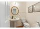 Half bathroom with pedestal sink and gold fixtures at 1006 Baldwin Ln, Waxhaw, NC 28173