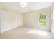 Bright bedroom featuring neutral walls, carpet, and large windows providing plenty of natural light at 1006 Baldwin Ln, Waxhaw, NC 28173