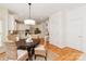 Dining room with a round table and natural wicker chairs in a brightly lit space at 1006 Baldwin Ln, Waxhaw, NC 28173