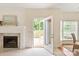 Bright living room with fireplace and open access to the backyard deck at 1006 Baldwin Ln, Waxhaw, NC 28173