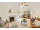 Open-concept living room with a fireplace, seamlessly connected to the dining and kitchen areas at 1006 Baldwin Ln, Waxhaw, NC 28173
