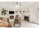 Inviting living room showcasing a fireplace, mounted TV, and comfortable seating area at 1006 Baldwin Ln, Waxhaw, NC 28173