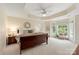 Spacious main bedroom with a tray ceiling, large windows, sitting area, and a king bed at 1006 Baldwin Ln, Waxhaw, NC 28173