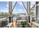 Relaxing outdoor seating on the balcony with scenic waterfront views and covered seating area at 1008 Southwest Dr # 8, Davidson, NC 28036