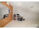 Spacious unfinished basement with vinyl flooring and a pegboard wall and electrical panel at 1008 Southwest Dr # 8, Davidson, NC 28036