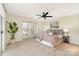 Large bedroom with ceiling fan, window with plantation shutters and neutral tones at 1008 Southwest Dr # 8, Davidson, NC 28036