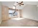 Bright bedroom featuring a large window with lake view and vaulted ceiling with ceiling fan at 1008 Southwest Dr # 8, Davidson, NC 28036