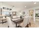 Open dining area with modern table, fireplace, water views and lots of natural light at 1008 Southwest Dr # 8, Davidson, NC 28036