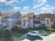 Charming blue condo with well-maintained landscaping and inviting curb appeal and covered entryway at 1008 Southwest Dr # 8, Davidson, NC 28036