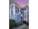 Exterior view of blue condominium building with white trim and well-maintained landscaping at 1008 Southwest Dr # 8, Davidson, NC 28036
