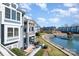 Exterior view of blue condominium buildings with lakefront access and a dock at 1008 Southwest Dr # 8, Davidson, NC 28036