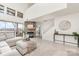 Well lit living room with fireplace, tall ceilings, and view of the lake at 1008 Southwest Dr # 8, Davidson, NC 28036