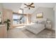 Bright main bedroom features an angled ceiling, large window and water views at 1008 Southwest Dr # 8, Davidson, NC 28036