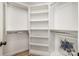 Walk-in closet featuring built-in shelving, closet rods, and hardwood floors at 1008 Southwest Dr # 8, Davidson, NC 28036