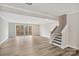 Spacious basement with luxury vinyl plank flooring, walkout access to the backyard, and stairs to the upper level at 108 Glencoe Ln # 105, Mooresville, NC 28117