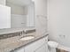 Bathroom featuring granite countertop vanity, modern fixtures, and a well-lit, clean space at 108 Glencoe Ln # 105, Mooresville, NC 28117