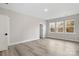 Bright bedroom with large windows, neutral walls, luxury vinyl plank flooring and natural light at 108 Glencoe Ln # 105, Mooresville, NC 28117