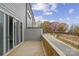 Outdoor deck offering a view of a sidewalk and fall foliage at 108 Glencoe Ln # 105, Mooresville, NC 28117